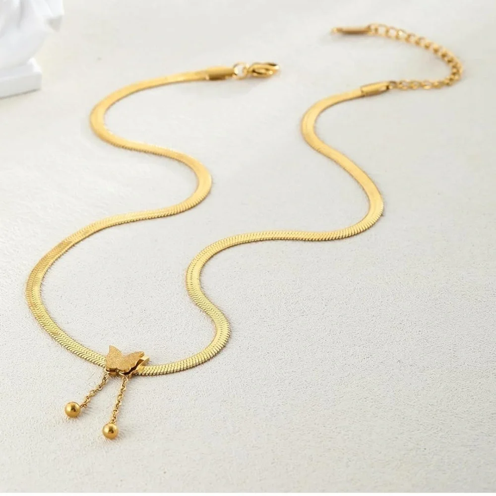 Herringbone style 14k plated gold necklace with butter slide pendant